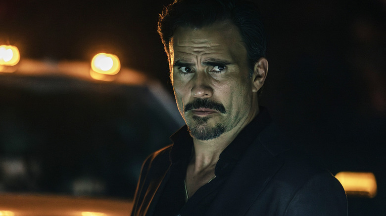 Juan Pablo Raba's Joaquin Reyes stands in front of a truck at night in Dutton Ranch