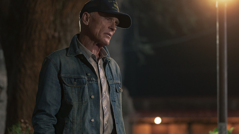Ed Harris' Everett McKinney stands outside at night in Dutton Ranch