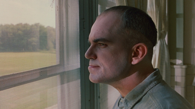 Billy Bob Thornton as Karl staring out a window in Sling Blade