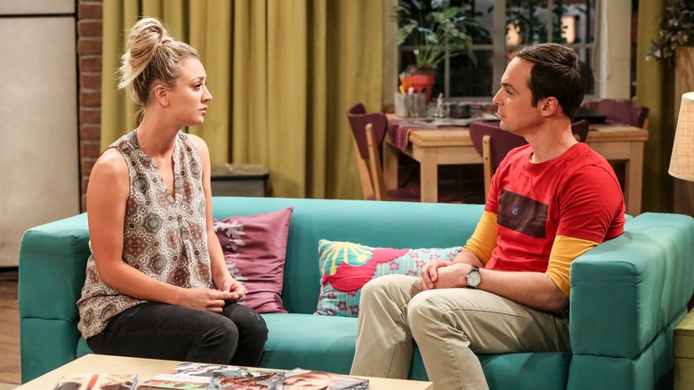 Kaley Cuoco's Penny and Jim Parsons' Sheldon sits on the couch and talks in the 