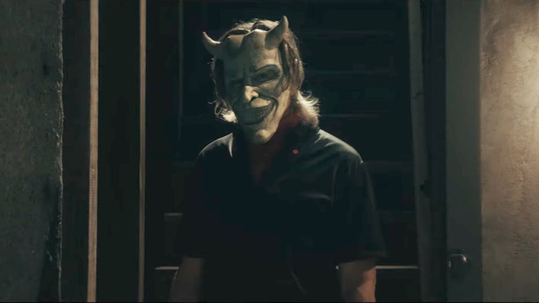 Ethan Hawke in The Black Phone wearing a creepy mask
