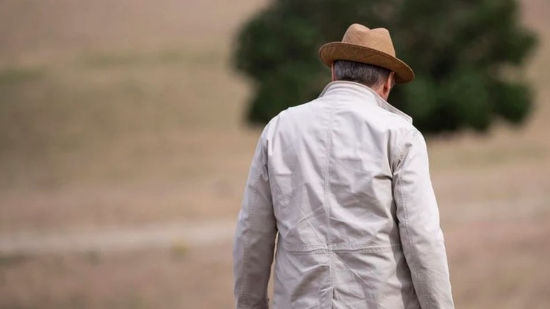 James Spader's Raymond Reddington walking on a field on The Blacklist