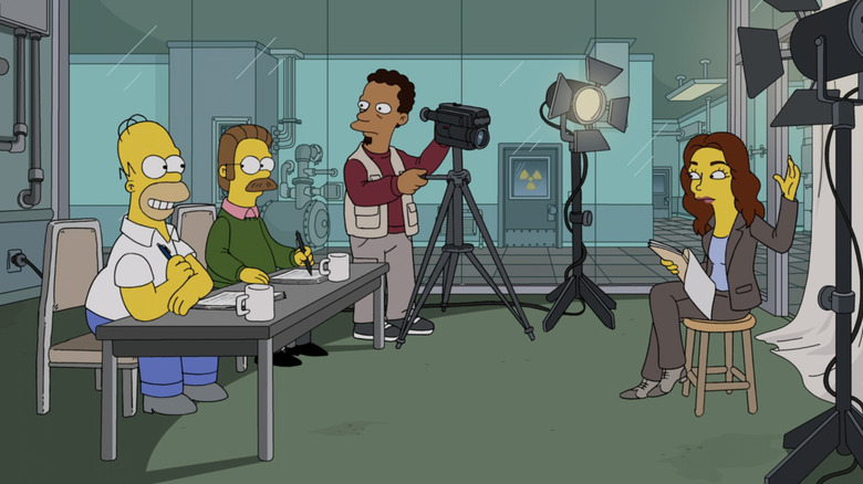 Home and Flanders sit at a table opposite Emily Deschanel in The Simpsons