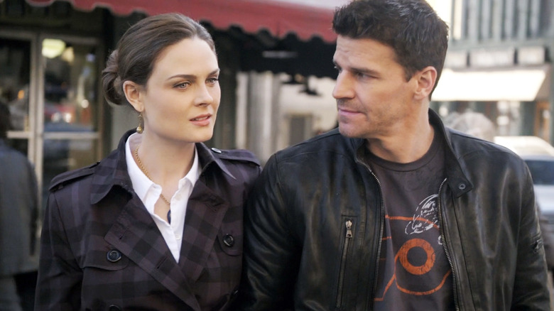 Emily Deschanel as Temperance Brennan walks arm in arm with David Boreanaz as Seeley Booth in Bones