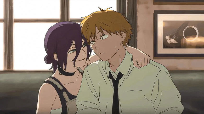 Reze holding an anxious Denji at a café in Chainsaw Man - The Movie: Reze Arc