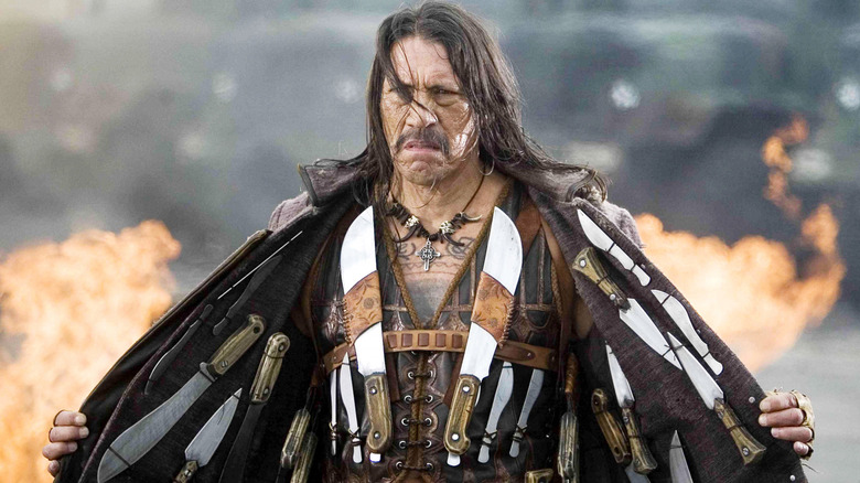 Danny Trejo showing off his weaponry in Machete