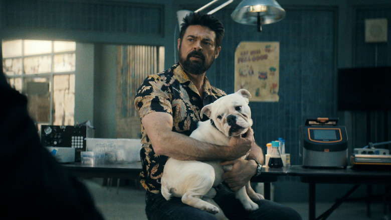 Karl Urban as Billy Butcher holding his dog Terror in The Boys