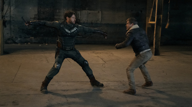 Jensen Ackles as Soldier Boy fighting Mason Dye as Bombsight in an empty warehouse in The Boys