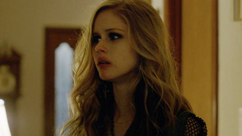 Erin Moriarty's Audrey Hart looks upset as she stands in her home in True Detective