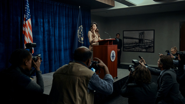 The Boys character at a podium