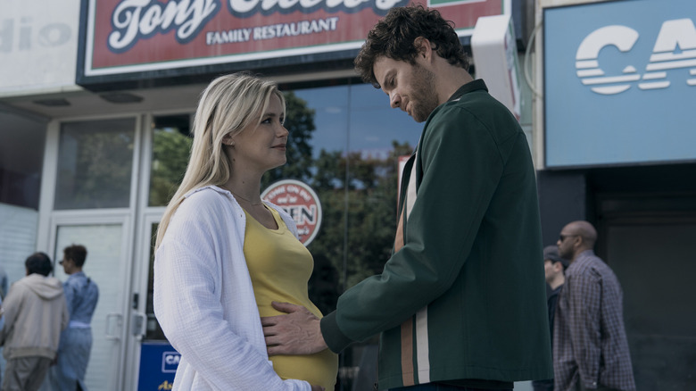 Erin Moriarty as Annie January and Jack Quaid as Hugh Campbell, standing outside his store in The Boys.
