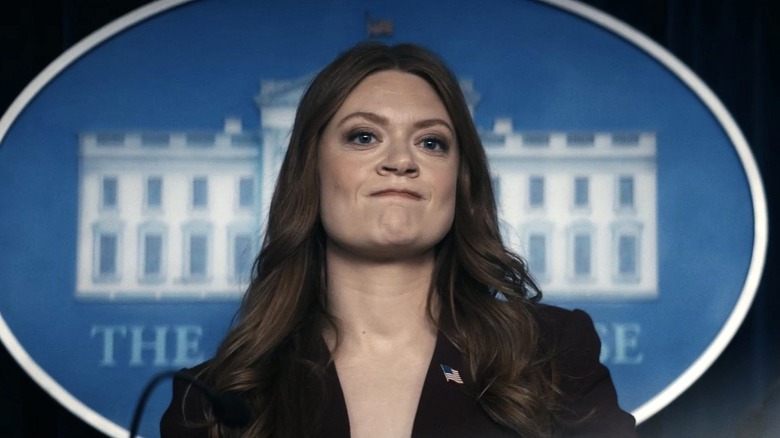 Colby Minifie as Ashley Barrett, standing in the White House press room in The Boys.