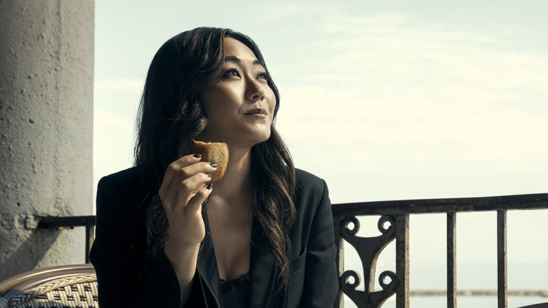 Karen Fukuhara as Kimiko Miyashiro, eating a madeleine in The Boys.
