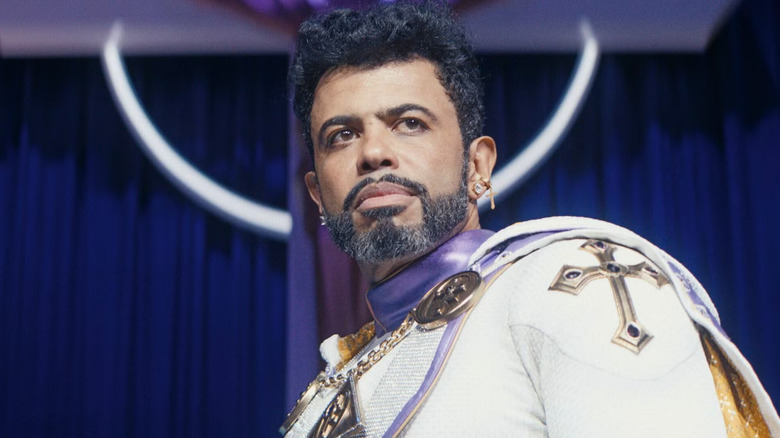 Daveed Diggs as Oh Father, looking out from his stage on The Boys.