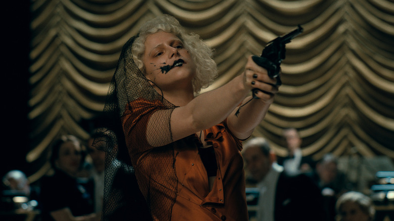 The Bride! holding a gun in the middle of a party