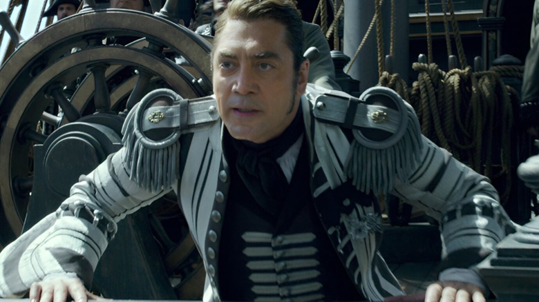 Javier Bardem as Captain Armando Salazar, looking over the edge of his ship in Pirates of the Caribbean: Dead Men Tell No Tales