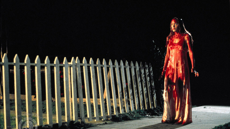 Carrie walks home after orchestrating a massacre in Brian De Palma's classic 1978 adaptation