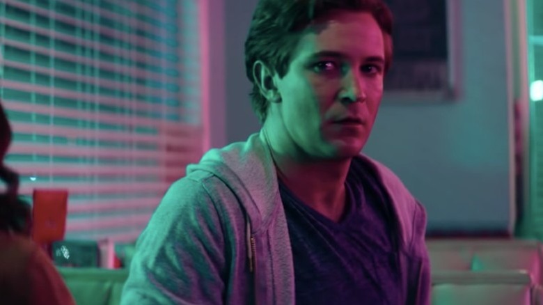 Michael Welch looking to the side
