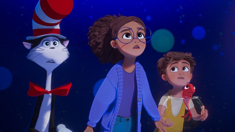 The Cat in the Hat standing with Gabby and Sebastian in front of some bubbles in The Cat in the Hat (2026)