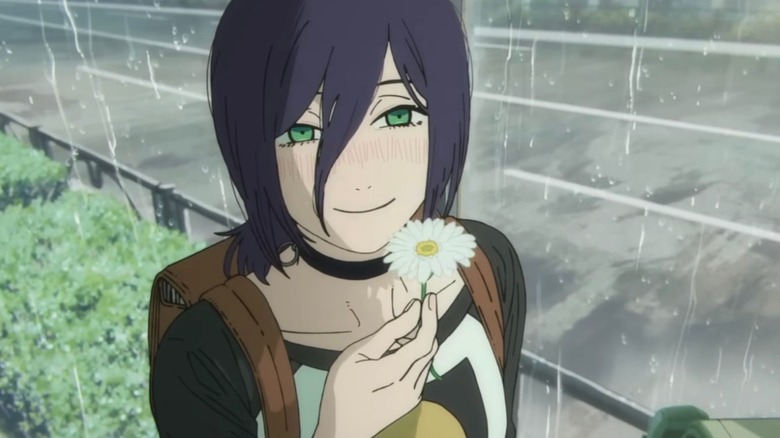 Reze holding flower and smiling in rain in Chainsaw Man - The Movie: Reze Arc