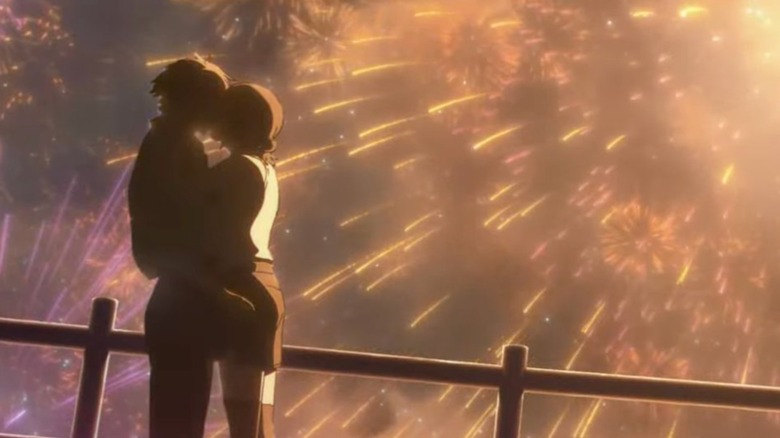 Denji and Reze kissing during fireworks at festival in Chainsaw Man - The Movie: Reze Arc