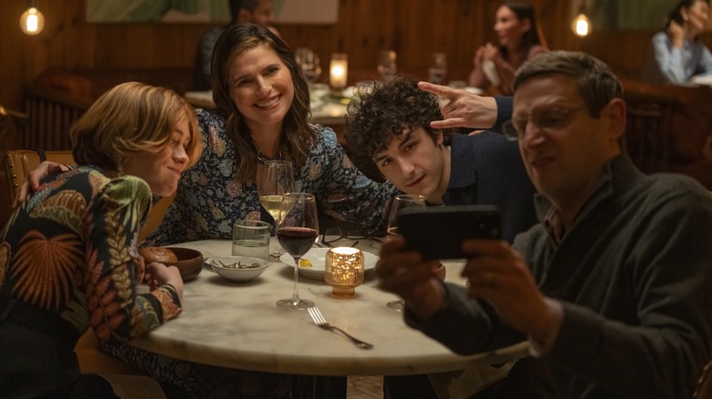 Ron and his family take a selfie during dinner in The Chair Company
