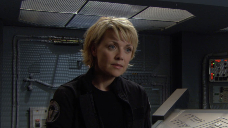 Christopher Judge's Teal'c stands at the SG-1 command center in Stargate SG-1