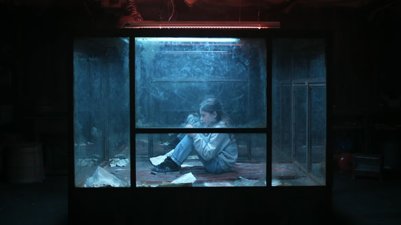 Minoo Andacheh's Alicia sitting captive in a glass box in The Glass Dome