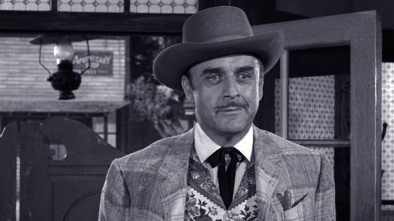 John Dehner as Jared Garrity enters a saloon in The Twilight Zone