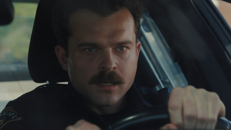 Paul drives his cop car in Weapons