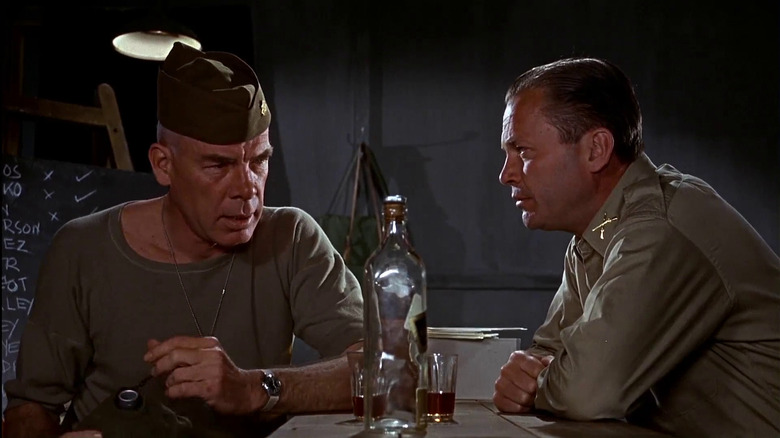 Major John Reisman having a drink with another soldier in The Dirty Dozen
