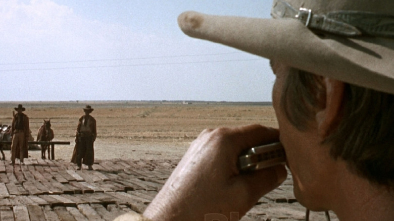 Harmonica monitors two cowboy in the West
