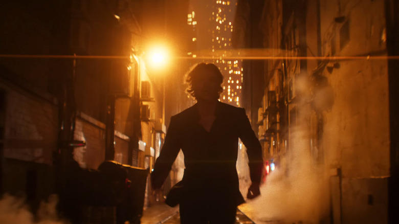 Tom Rhys Harries as Matt Hagen running down an alley in Gotham City in Clayface