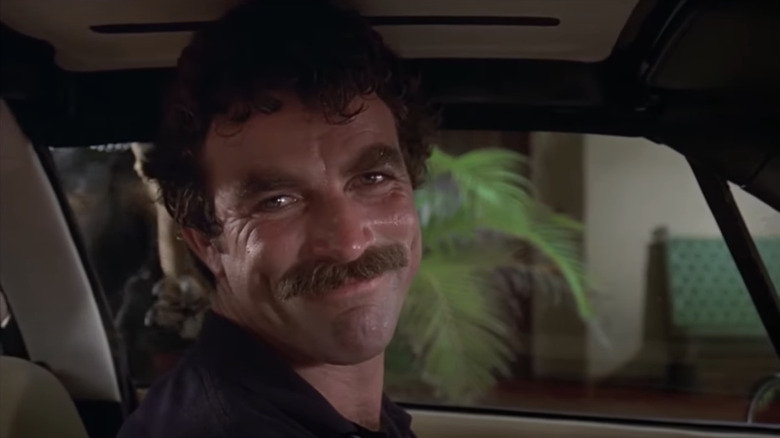 Thomas Magnom is smiling from Tom Celik sitting in a car in Magnum, P