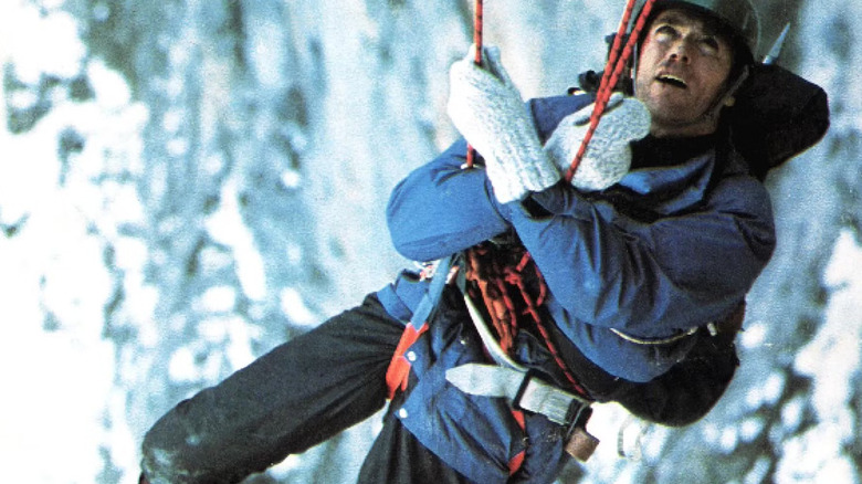 Clint Eastwood's Jonathan Hemlock dangling from a rope in The Eiger Sanction