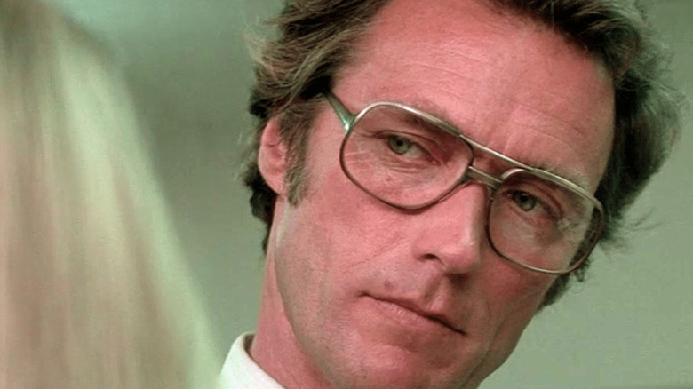 Clint Eastwood's Jonathan Hemlock looking flirtatiously at a young woman in The Eiger Sanction