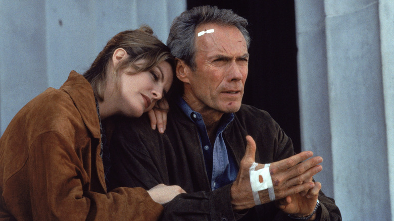 Clint Eastwood's injured Frank Horrigan is comforted by Rene Russo's Lily Raines in In the Line of Fire