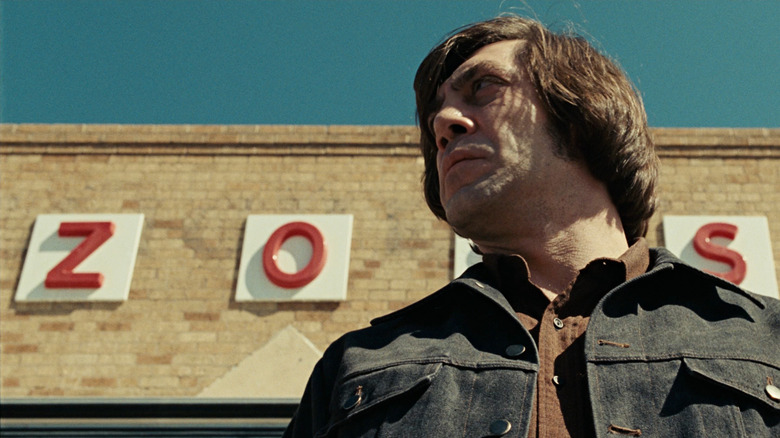 Javier Bardem looms as Anton Chigurh in No Country for Old Men