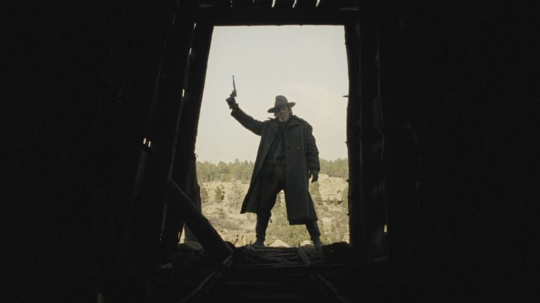 Jeff Bridges prepares to fire shot as Rooster Cogburn in True Grit