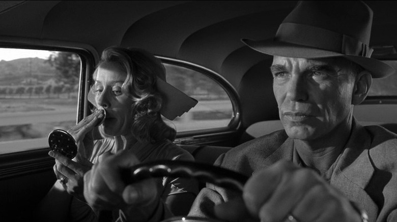 Frances McDormand and Billy Bob Thornton driving as Doris and Ed Crane in The Man Who Wasn't There