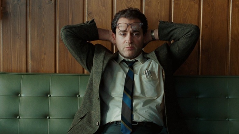 Michael Stuhlbarg's Larry Gopink waits on a couch in frustration in A Serious Man