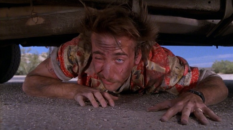 Nicolas Cage's H.I. McDunnough hides under car in Raising Arizona