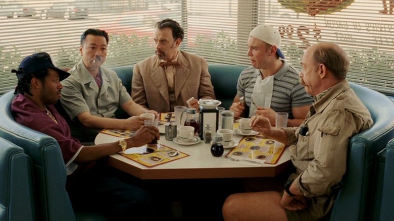 Tom Hanks as Professor G.H. Dorr eating lunch in The Ladykillers