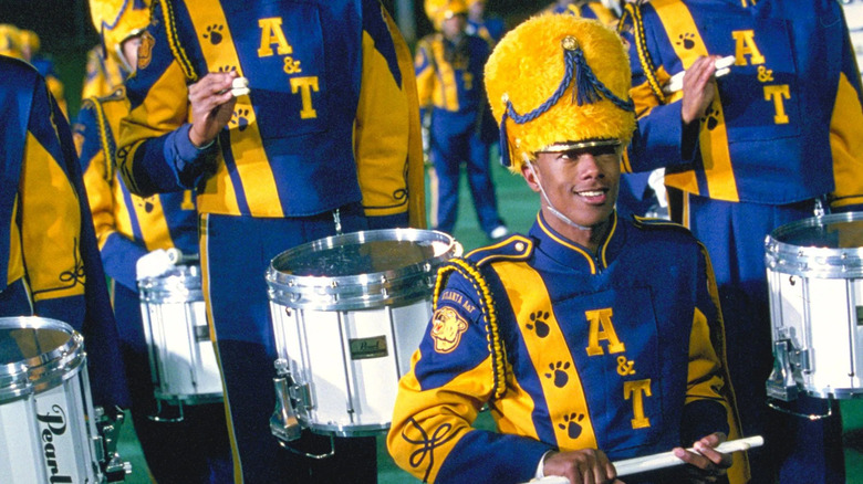 Devon Miles leading a marching band in Drumline
