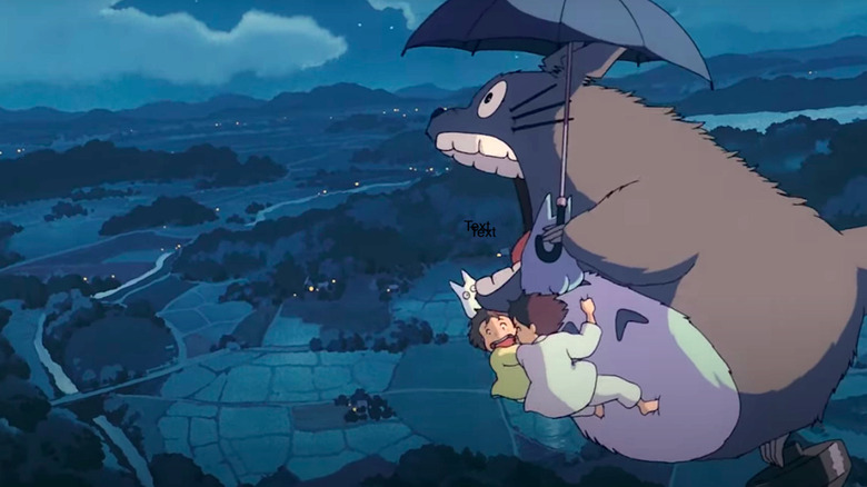 Totoro flies with Mei and Satsuki over the neighborhood
