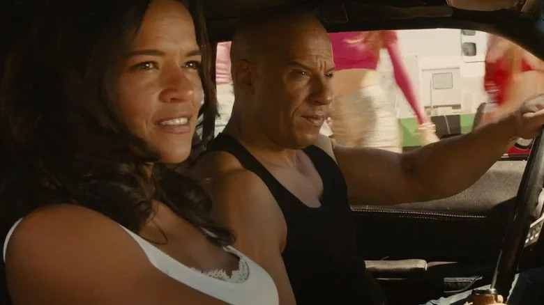 Dom driving in car with Letty in Los Bandoleros