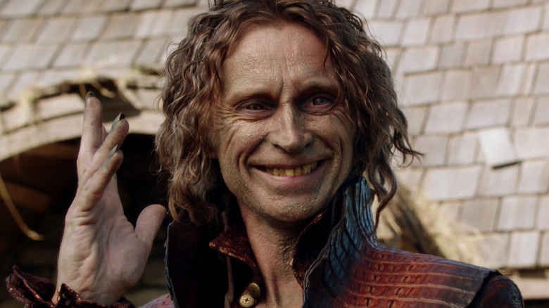 Robert Carlyle as Rumplestiltskin, grinning on Once Upon A Time