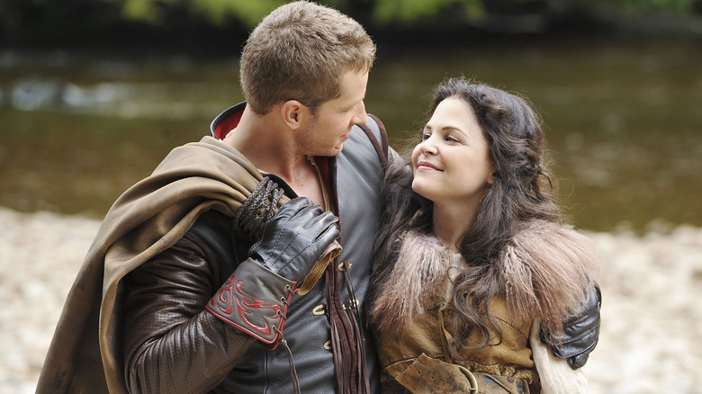 Josh Dallas and Ginnifer Goodwin as Prince Charming and Snow White, embracing each other on a beach on Once Upon A Time