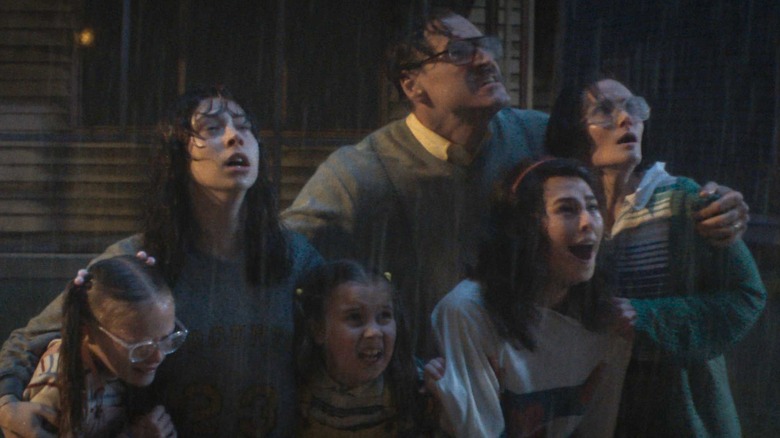 The Smurl family are caught out in the rain in The Conjuring: Last Rites