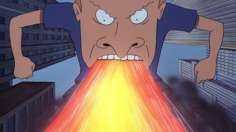 Beavis, as a kaiju, breathing fire on a city.